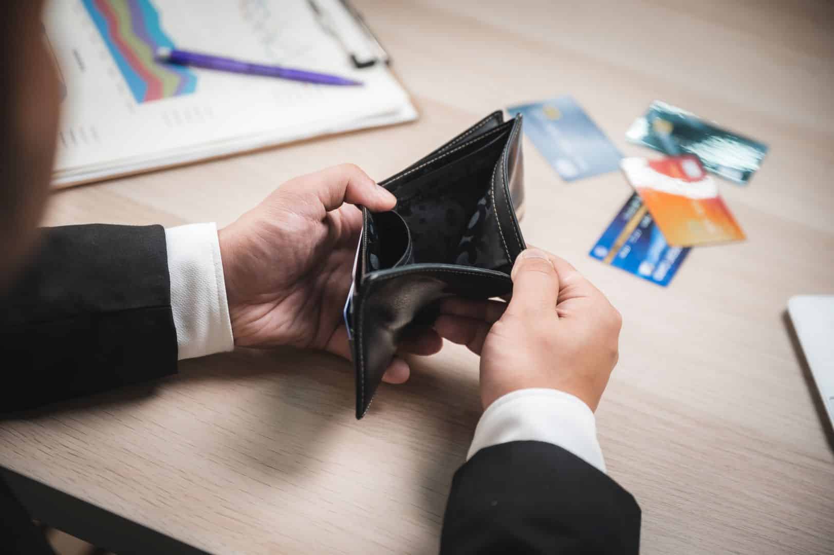 High angle closeup view of hands of a businessman in formal clothing looking